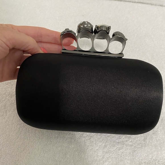 Skull Ring Knuckle Clutch with Chain Strap
McQueen inspired studded design - Picture 8 of 10